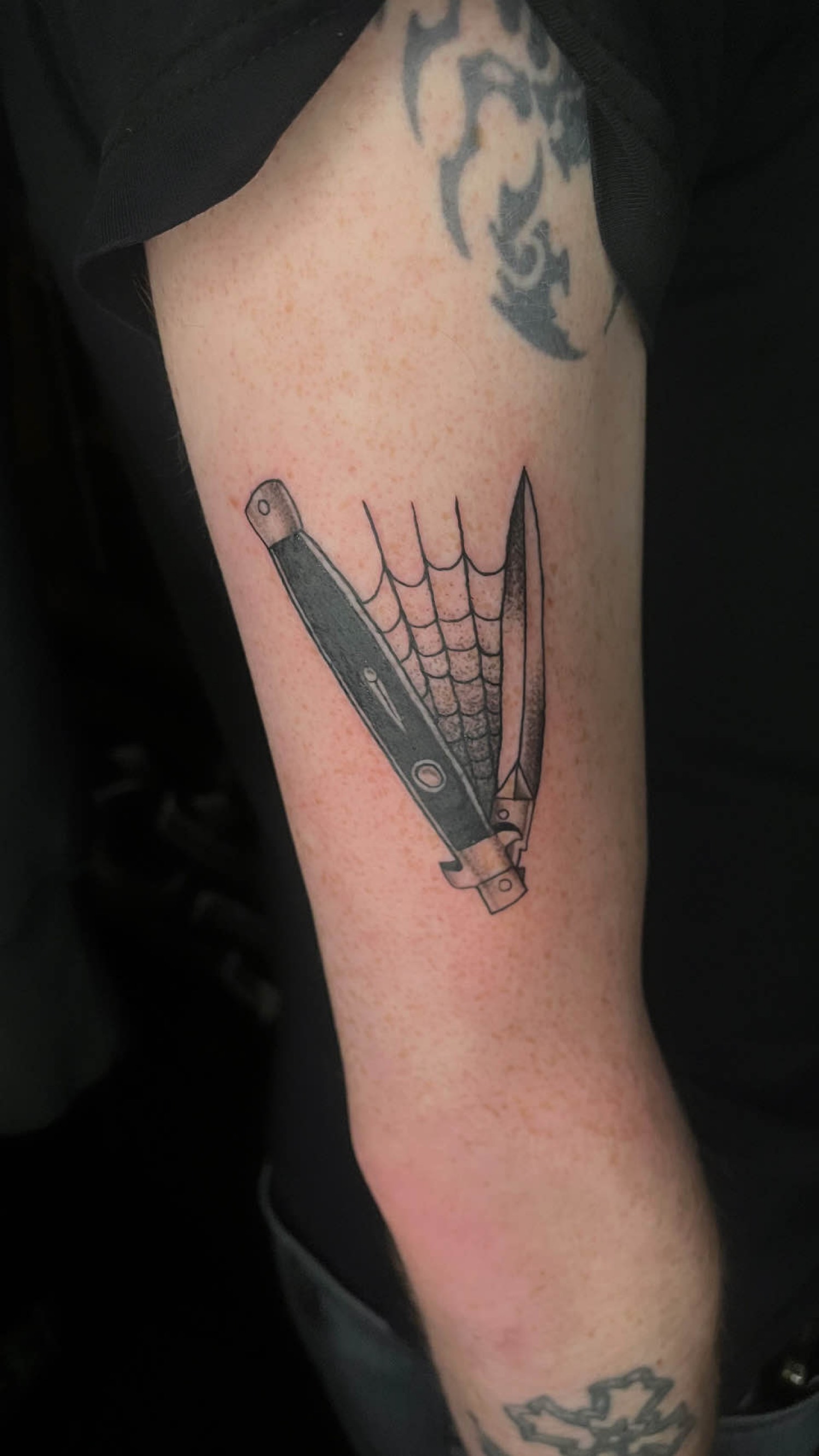 Klappmesser mit Spinnennetz
